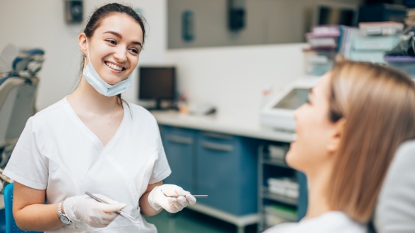 Dental team member smiling at a patient